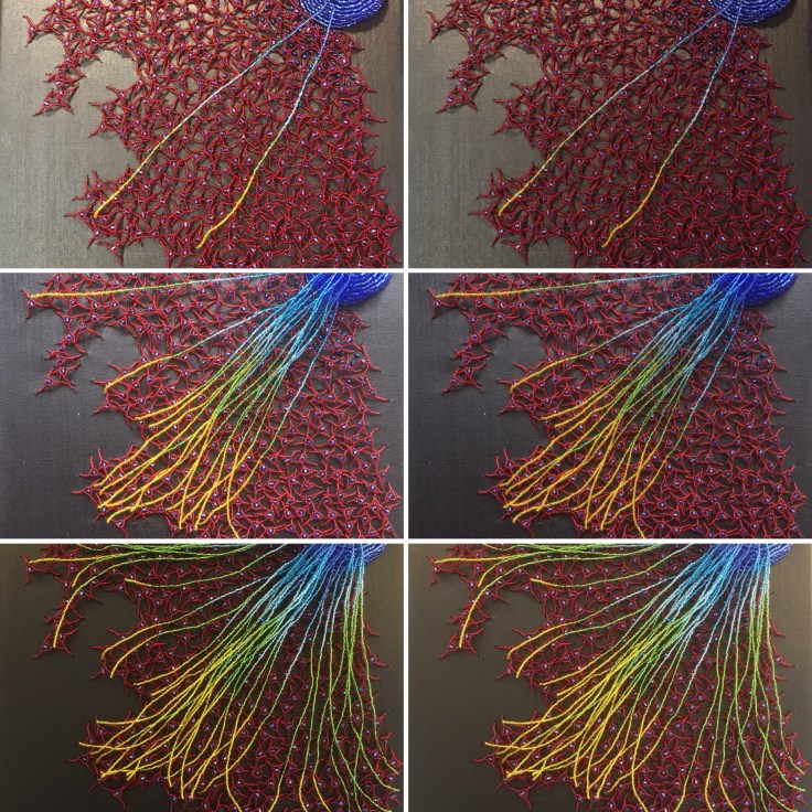 Microscopy-inspired bead embroidery showing a blue neurosphere spreading into a red astrocyte layer with neurons forming a blue-to-yellow gradient, drawn toward a white jewel.