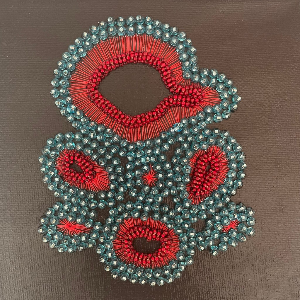 bead embroidered canvas depicting an intestinal organoid